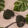 "The Badass II" sunglasses, featuring a Leadwood frame and Antique Silver accents, with a classic and stylish design.