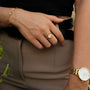 "Pixa Ring", a stylish gold ring with white nacre accent, adding elegance to any outfit.