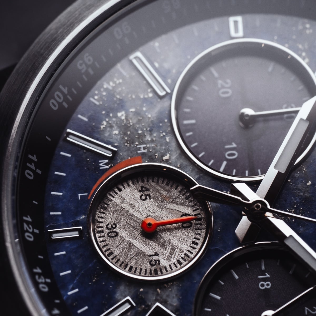 "Paracas" watch features a sophisticated Lapis Lazuli and silver design with intricate dial details.