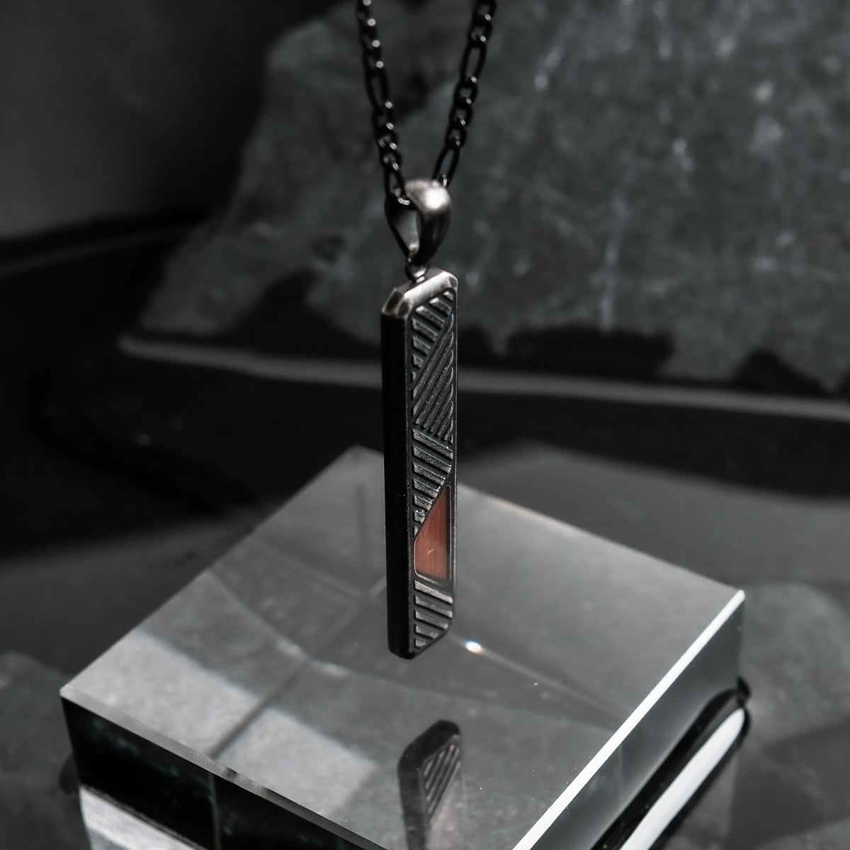 "Derivatives Necklace" necklace, featuring Walnut and antique silver, showcasing a sleek, modern design.