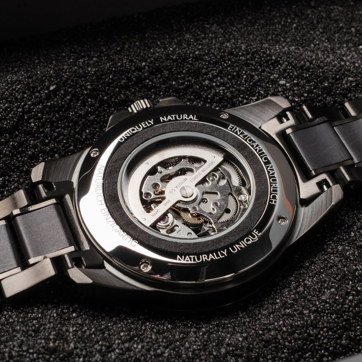 "Navona" watch featuring a sleek mechanical design with a maple accent and metallic finish.