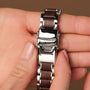 "Colorburst" watch featuring a sleek metallic finish and stylish wood inlay, combining elegance with natural elements.