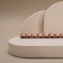 Duet keyboard with a walnut and rose gold finish, showcasing a sleek and elegant design.