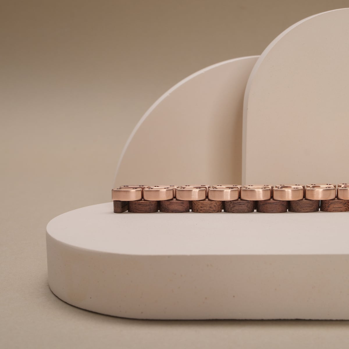Duet keyboard with a walnut and rose gold finish, showcasing a sleek and elegant design.