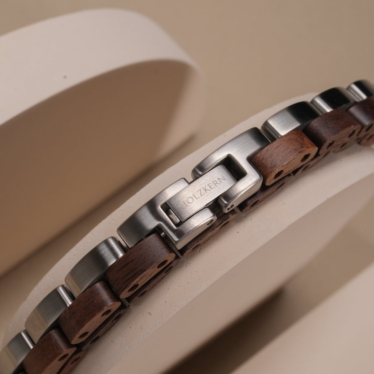 "Duet" bracelet featuring a walnut and silver design with a sleek, modern style.