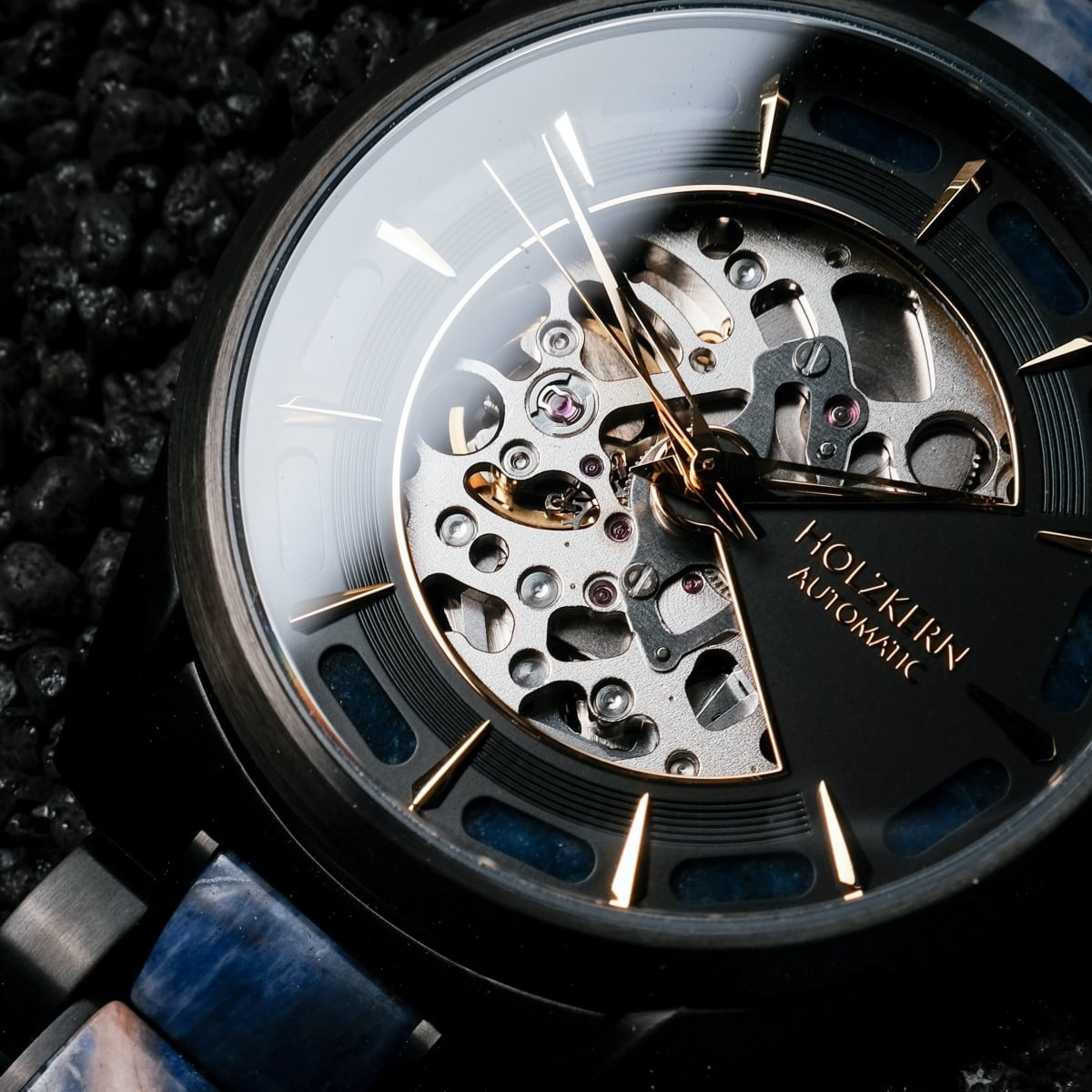"Vredefort" watch with a marble and black design featuring a detailed mechanical face on a textured background.