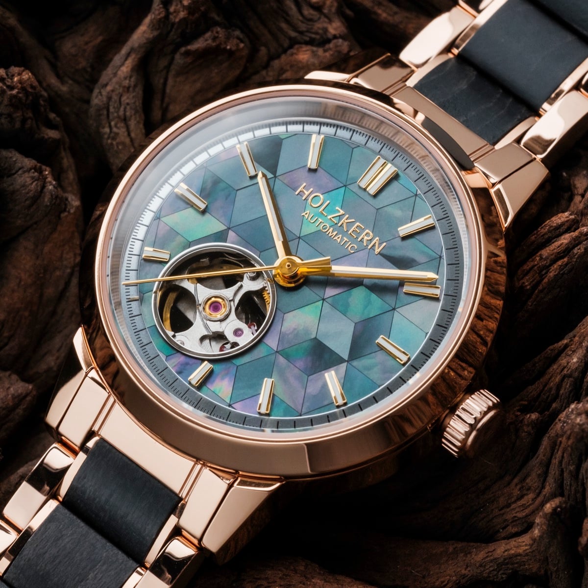 "Luminaire" watch with a nacre and maple design, featuring a geometric-patterned dial and metallic accents.