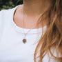 "Mandala Necklace" necklace featuring a geometric walnut and silver design for a modern, stylish look.