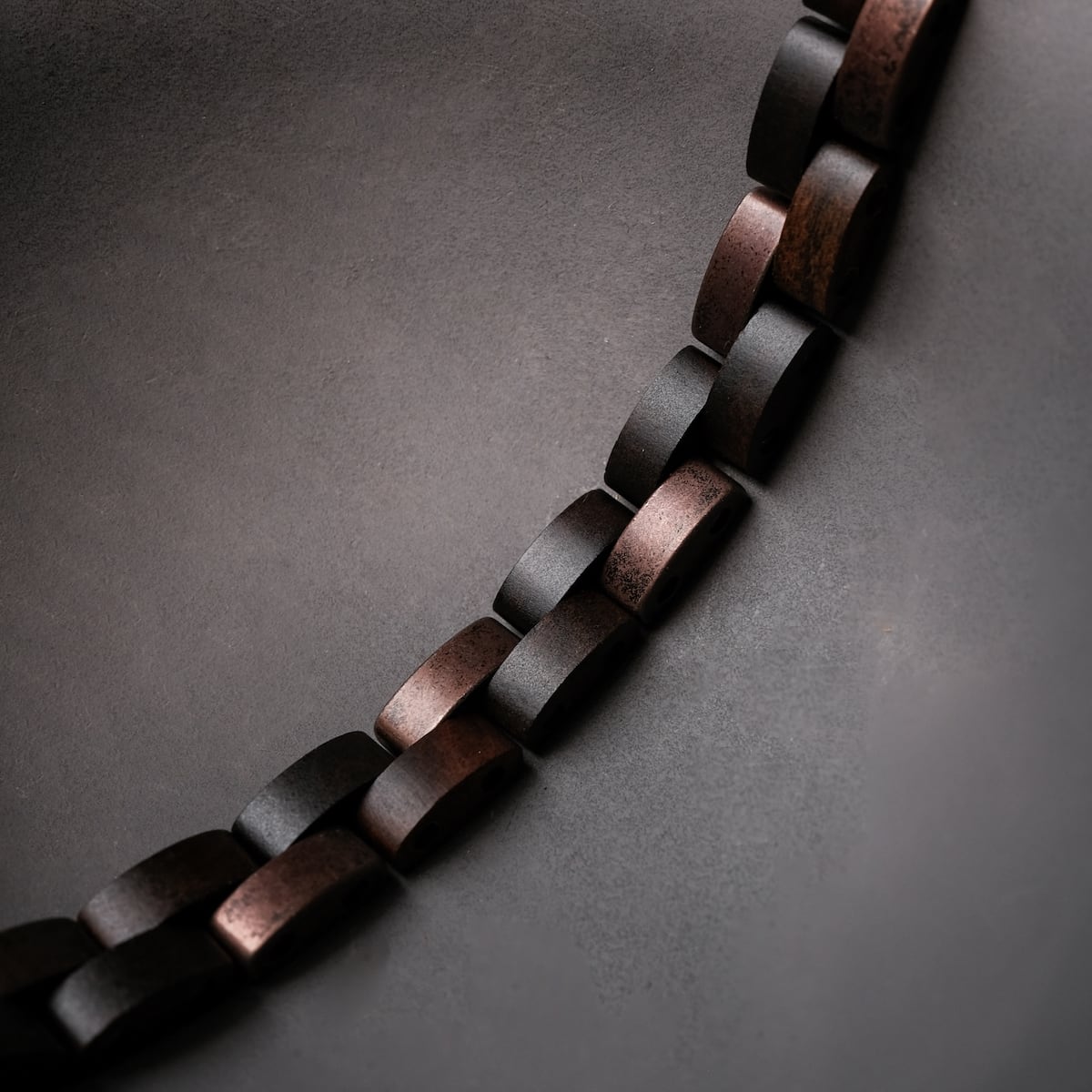 "Rondo" bracelet featuring a maple and antique copper design in a modern and elegant style.
