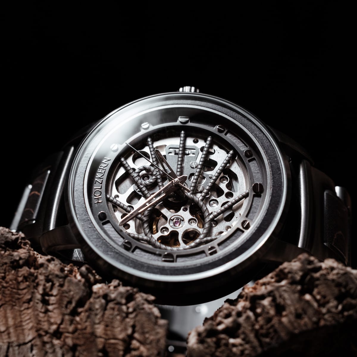 "Carbon" watch, featuring a Gray Maple and Dark Gray design with an intricate, mechanical aesthetic.