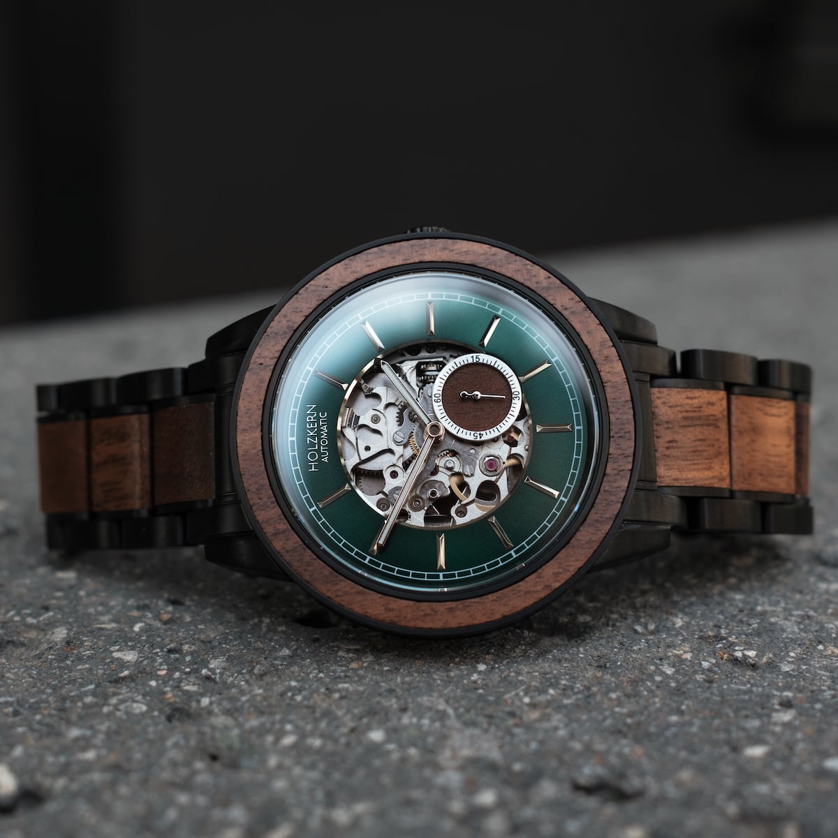 "Sigiriya" watch featuring a walnut body and strap with a sophisticated mechanical design and green dial.