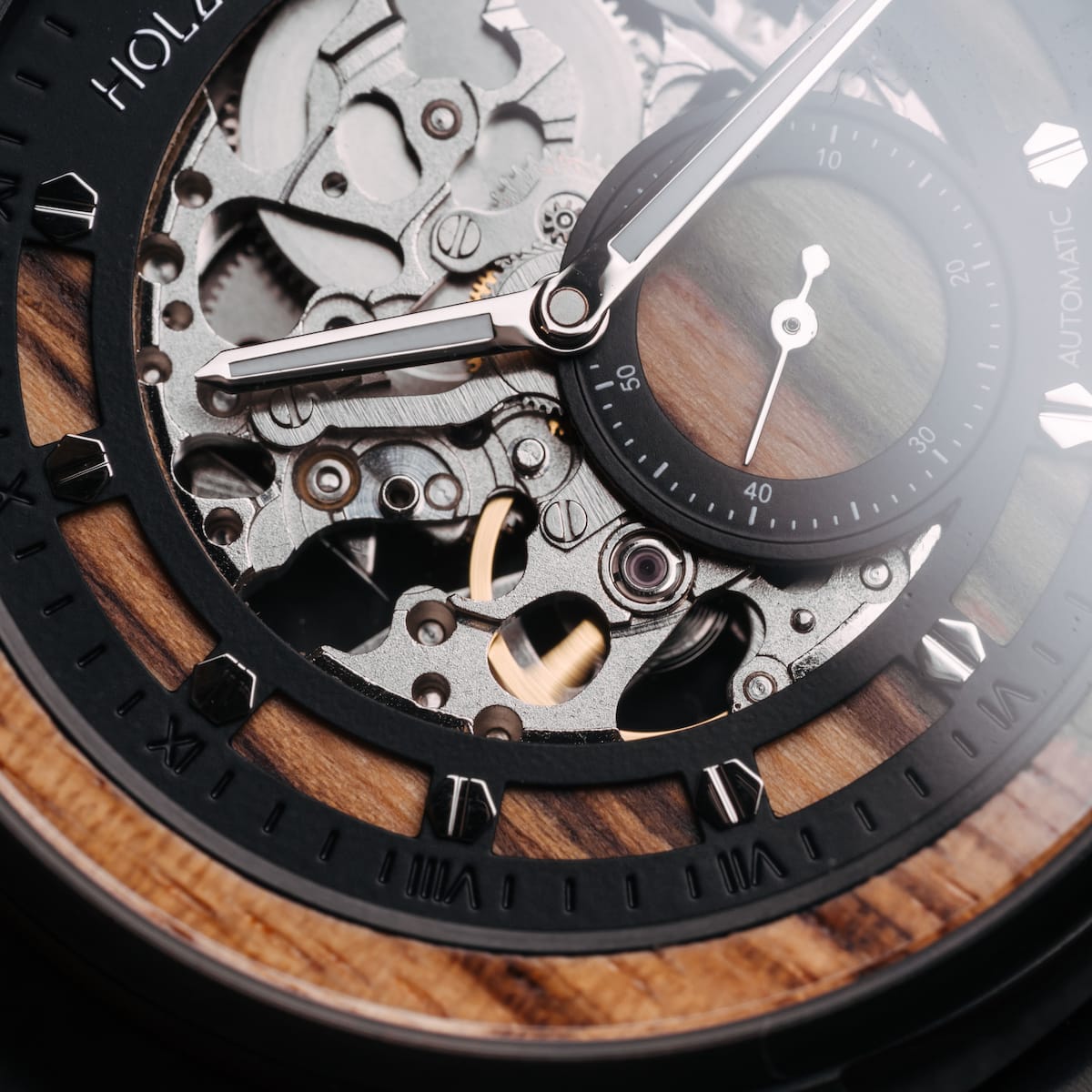 Starrum wristwatch featuring Zebrawood and black detailing with a mechanical, intricate design.