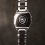 "Kéré" watch with a maple design, featuring a sleek, modern style with a metal and dark wood band.