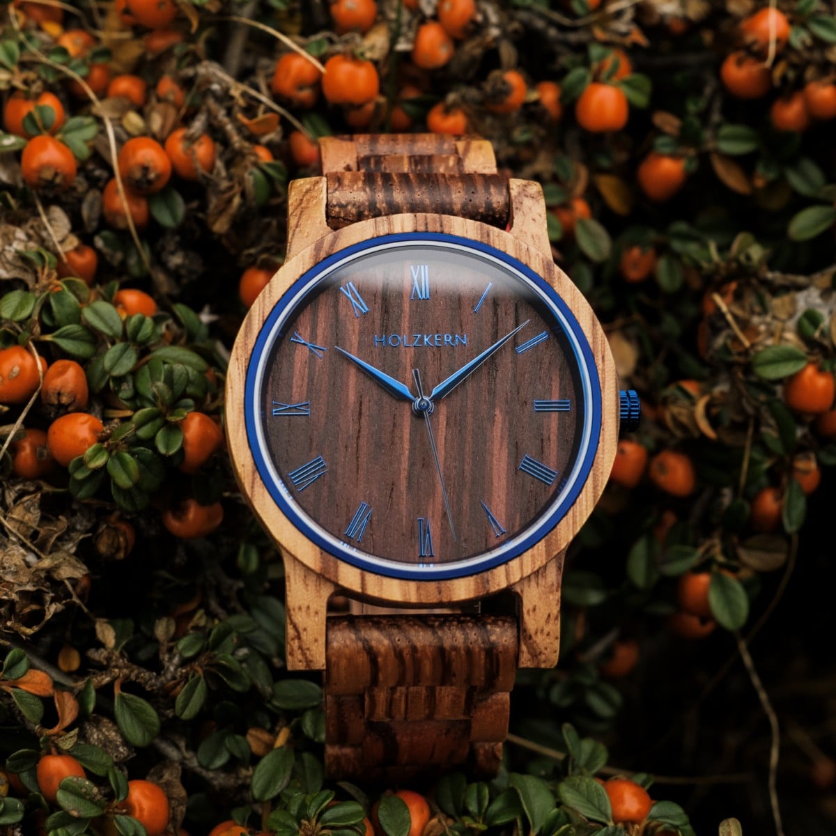 "Fall Morning" watch featuring a Zebrawood and Wenge design, surrounded by autumn berries and greenery.