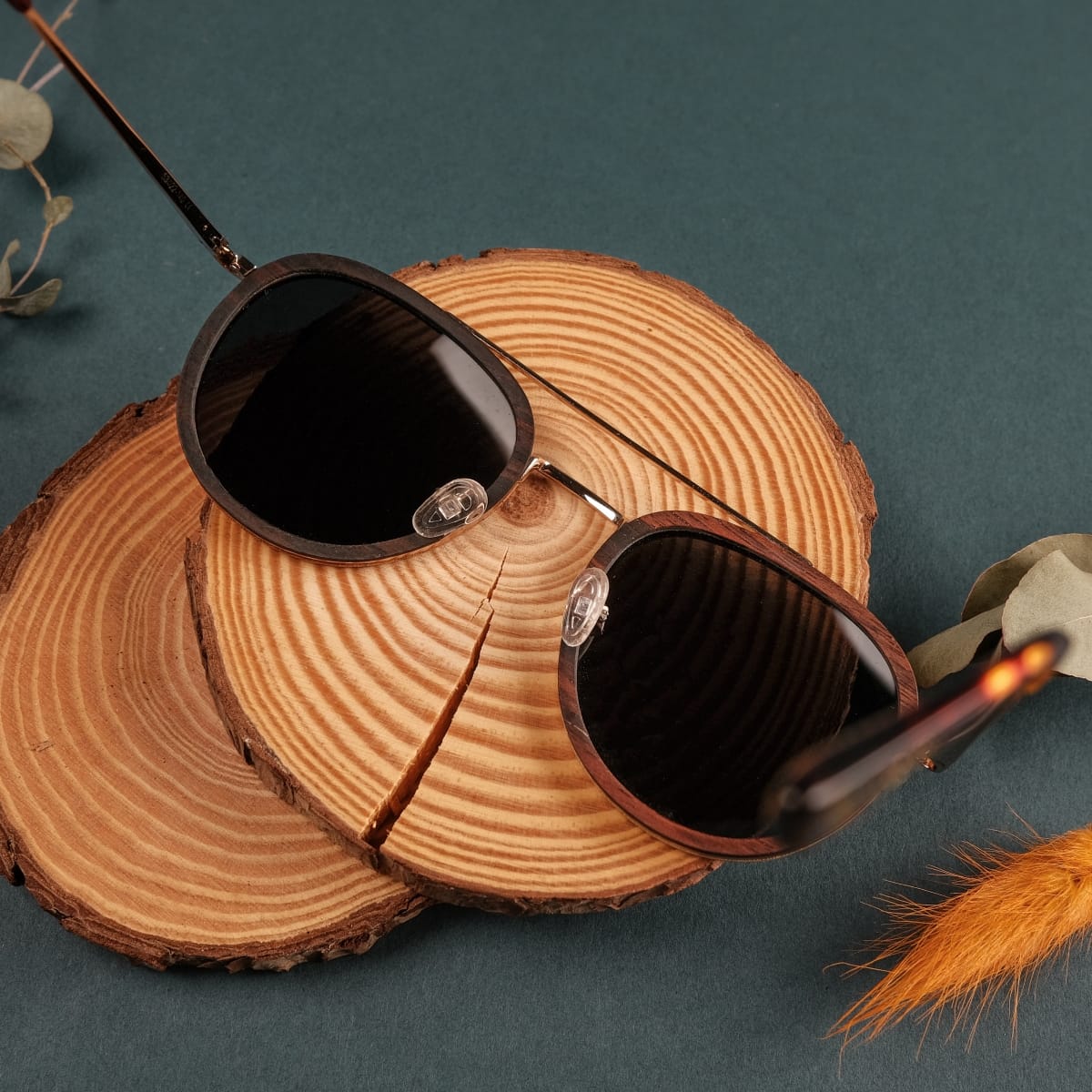 "The Risky" sunglasses with zebrawood frames and matte gold accents, exuding a natural and elegant style.
