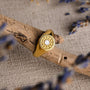 "Pixa Ring", a gold and white nacre ring, showcasing a textured and elegant design.