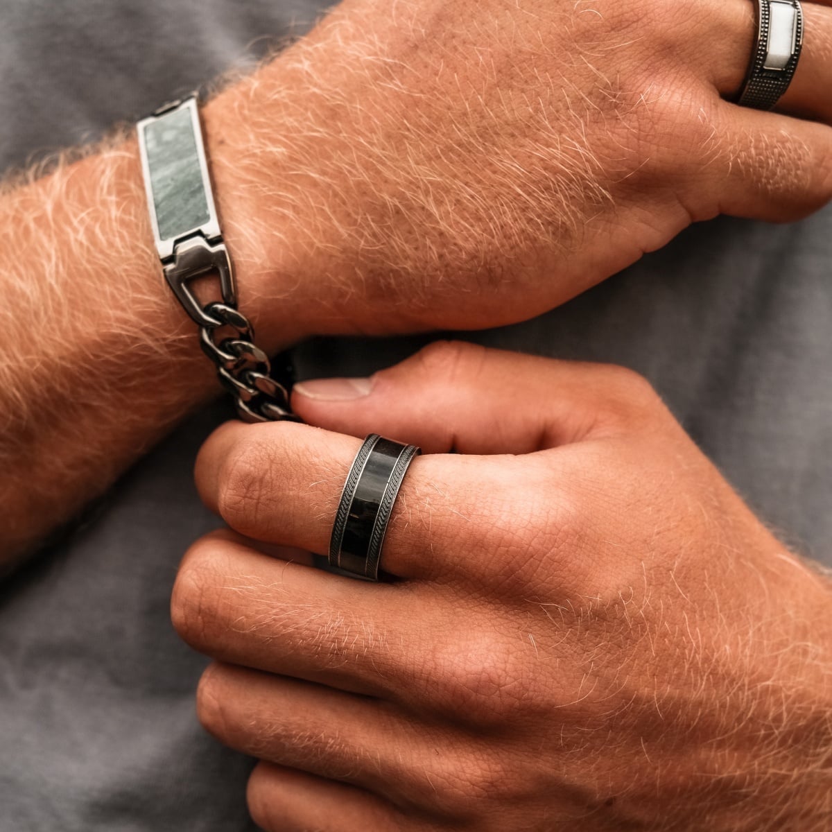 "Countless Ring", a stylish ring with maple and antique silver finish, shown worn on a man's hand.