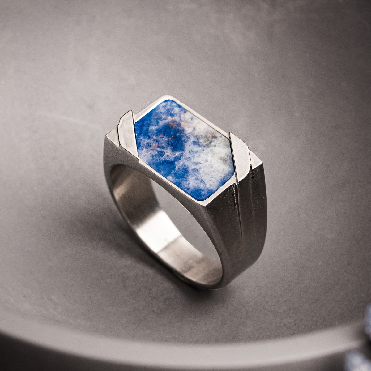 "Binomial Ring" ring featuring a bold, rectangular sodalite stone set in silver for a modern, geometric style.
