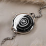 "Brighter" watch featuring a nacre and silver design with a sleek, modern aesthetic.
