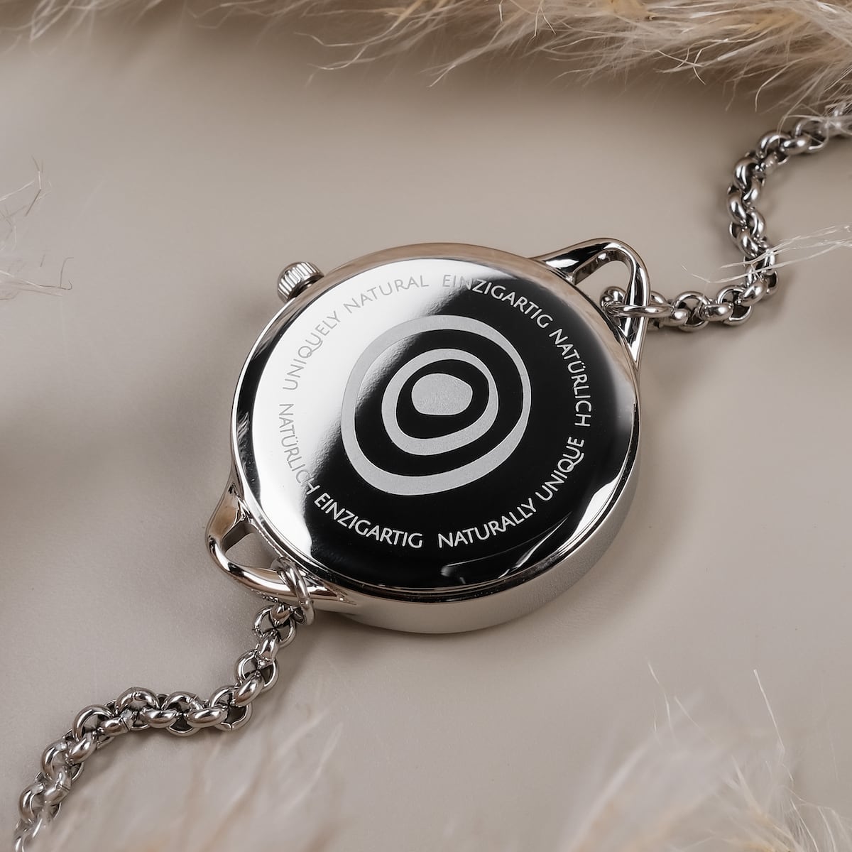 "Brighter" watch featuring a nacre and silver design with a sleek, modern aesthetic.