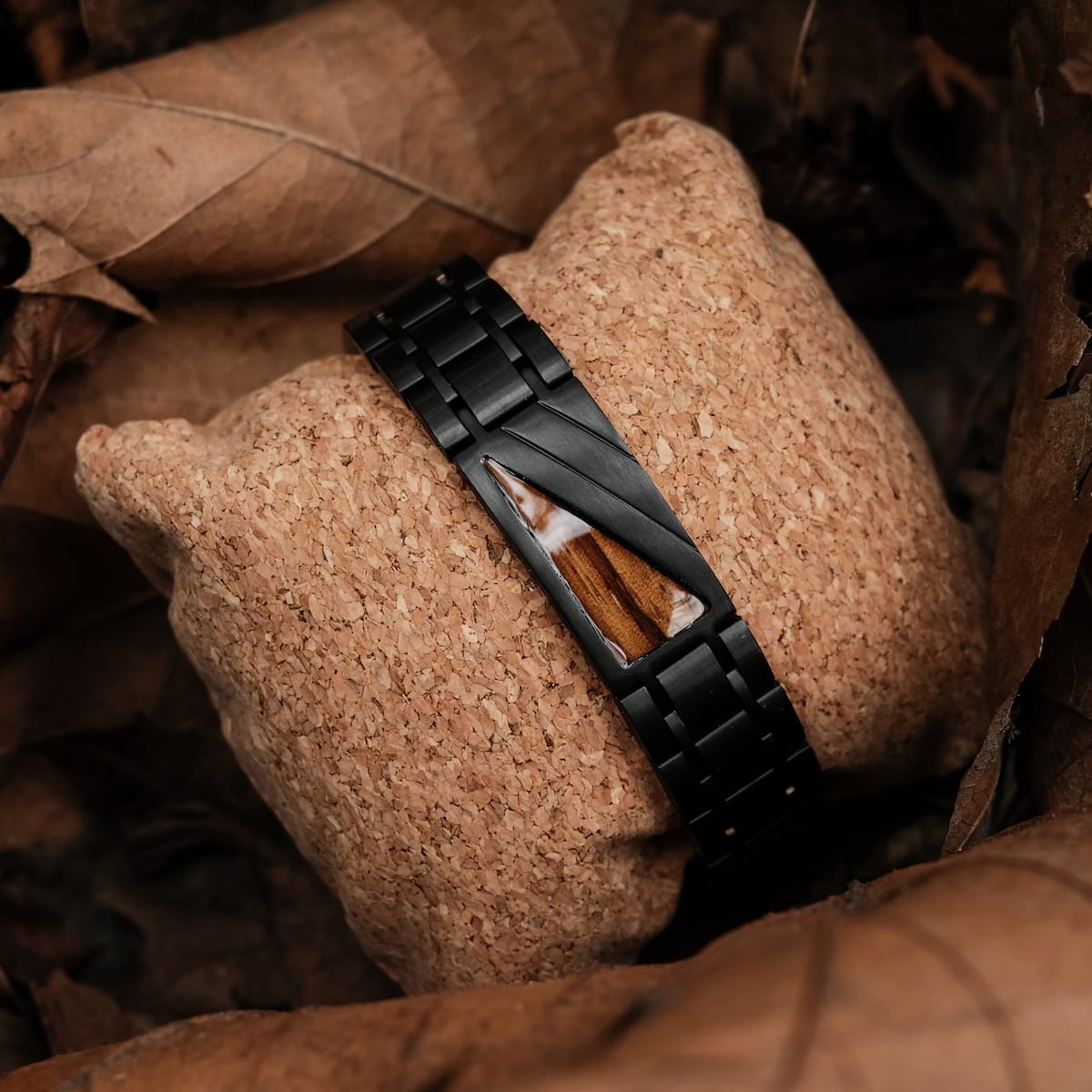 "Looper" bracelet featuring zebrawood and black elements, styled with an elegant and modern design.
