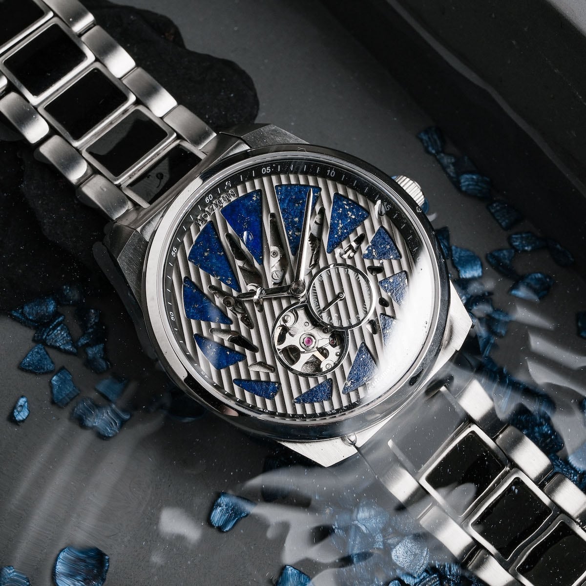 "Spikes watch, featuring a striking lapis lazuli and maple design with intricate metallic elements."