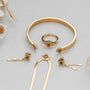 "Awakening Necklace", a gold and marble necklace, featuring elegant and intricate designs.