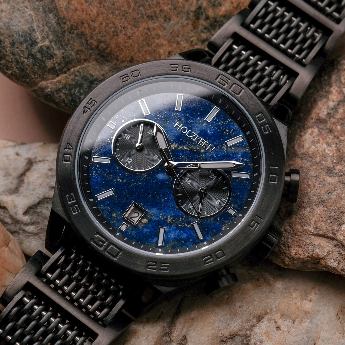 "Aoraki" watch, featuring a lapis lazuli dial and black finish with a rugged, elegant design.