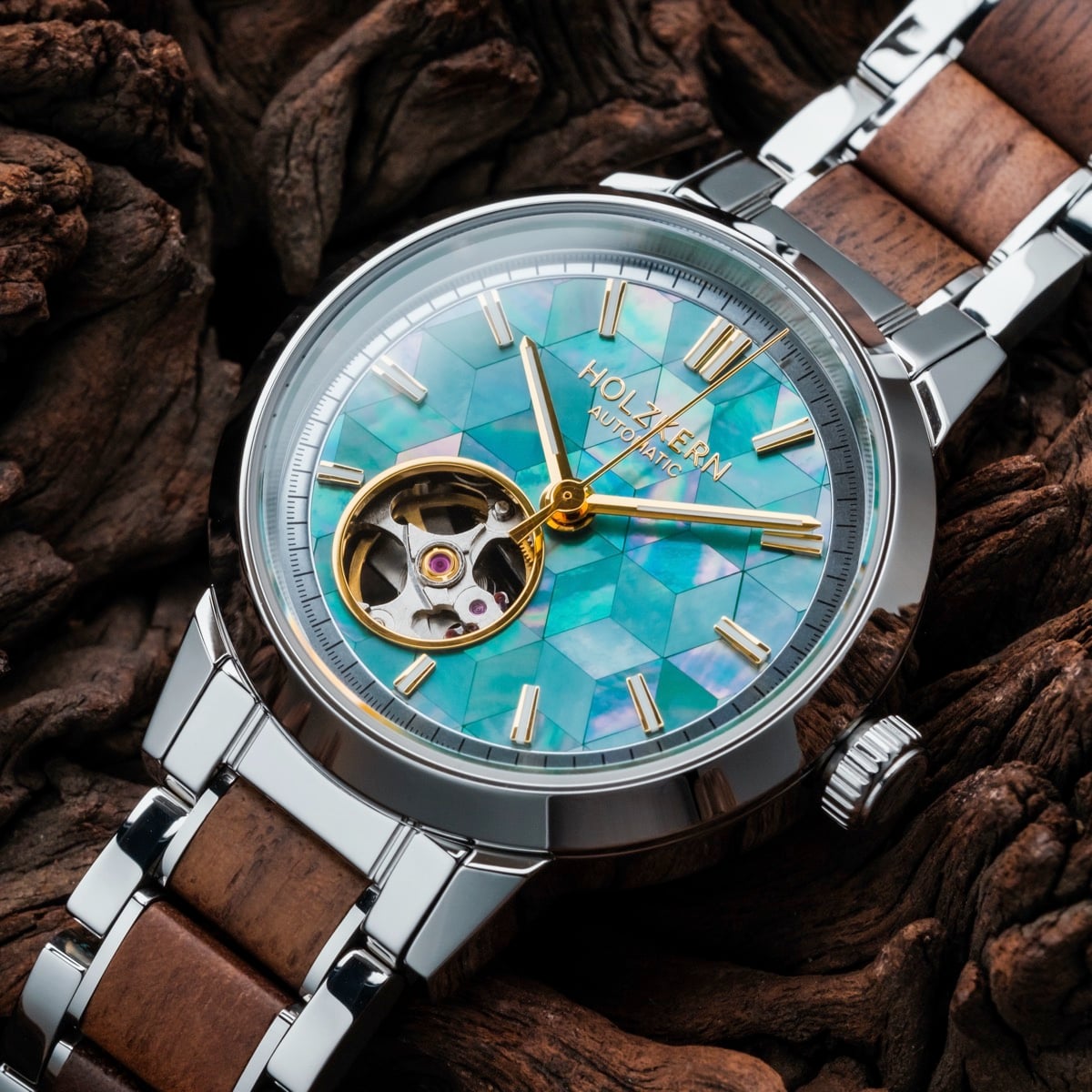 "Colorburst" watch featuring a vibrant nacre dial and walnut accents, blending elegance with natural style.