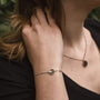 "Opacity Bracelet" bracelet featuring walnut and silver, showcasing a sleek and modern design.