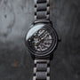"Carbon" watch, featuring a gray maple and dark gray style, showcases a sleek, modern design with intricate detailing.