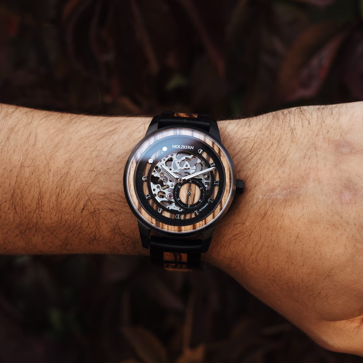 Starrum watch featuring zebrawood and black accents in an elegant, mechanical design.