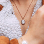 Mirror Necklace: a stylish necklace with a turquoise center set in rose gold, offering an elegant and modern look.