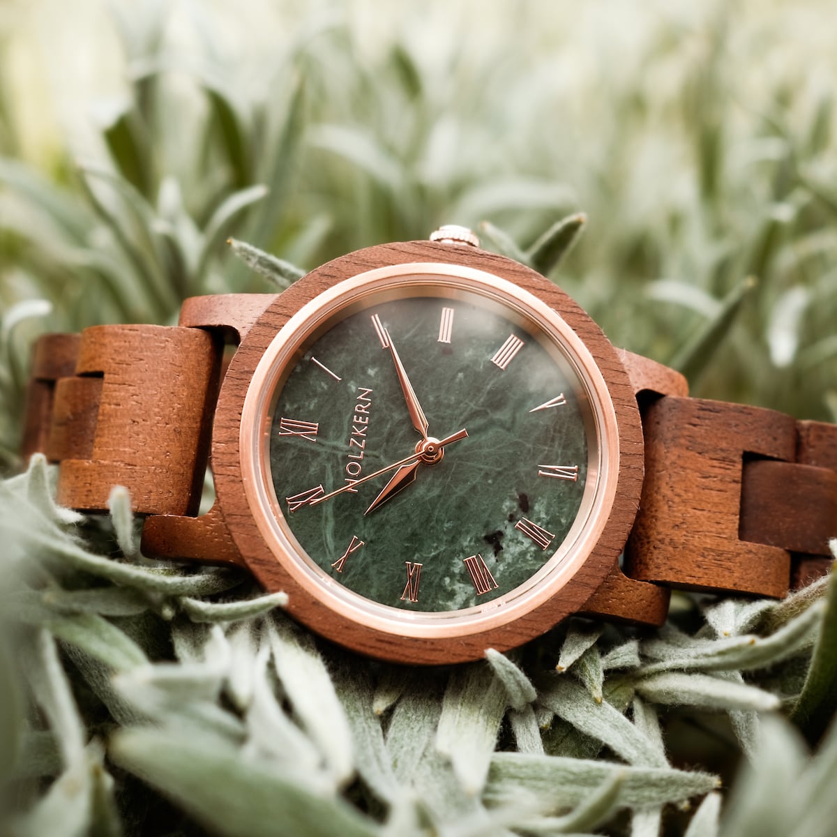 "Nymph" watch featuring a natural Walnut band and marble face, with an elegant and earthy visual style.