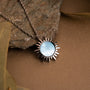 "Shade Necklace" - a sunburst-inspired necklace featuring blue nacre and silver tones.