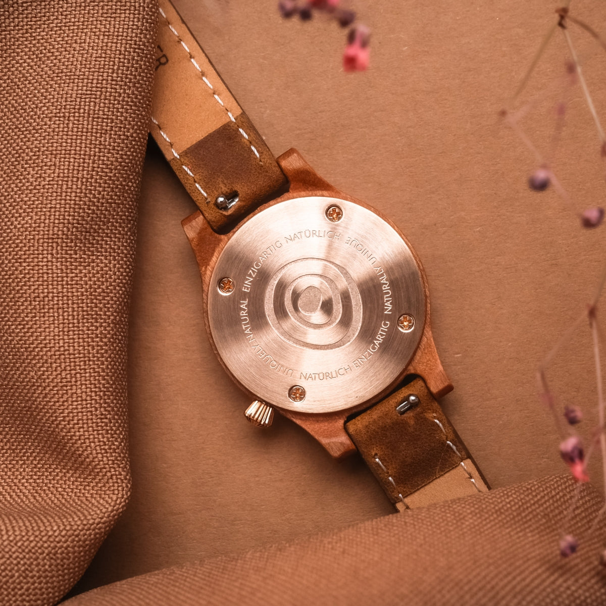 "Cinque Terre watch with a cherrywood back and nacre accents, showcasing a natural and elegant design style."