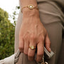"Pixa Ring", a stylish gold ring with white nacre accents.