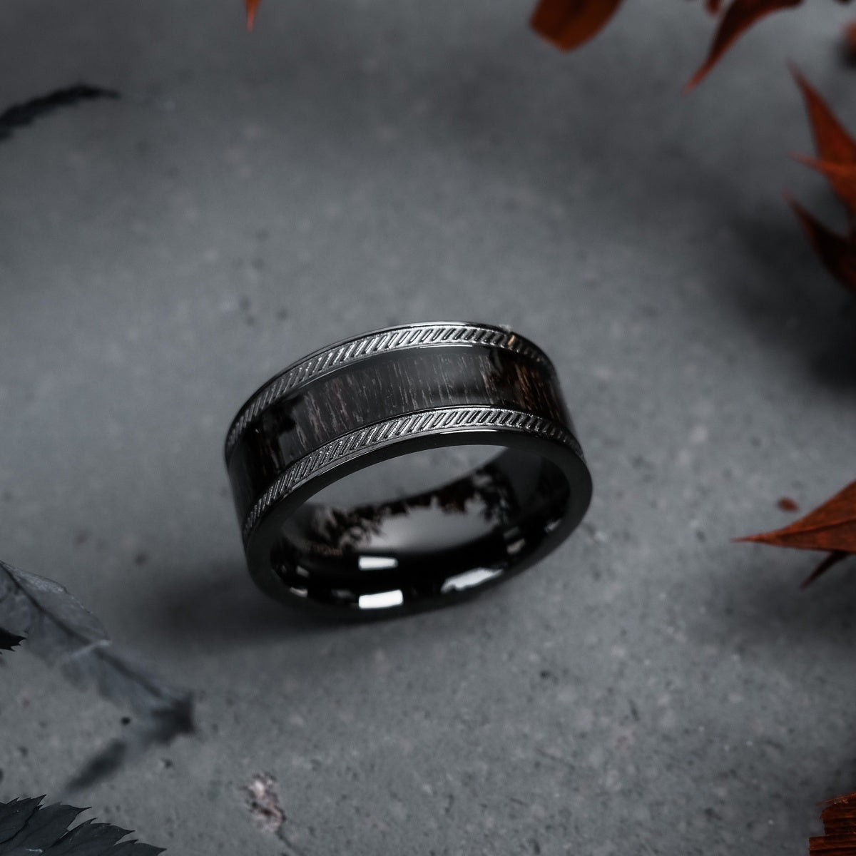 "Countless Ring" ring featuring a maple and dark gray design with a sleek, modern style.