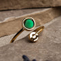 "Zendala Ring" - an elegant ring featuring green nacre and gold design.