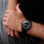 "Rackets watch featuring a sleek black design on a wrist."