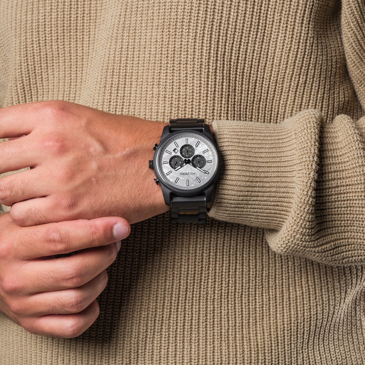 "Northwall" watch with a maple and rock gray design on a person's wrist.