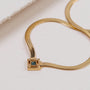 "Awakening Necklace" necklace featuring a luxurious marble and gold design.