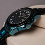 "Glaciersurge", a sleek watch featuring a hawk's eye design, showcases a polished and modern maple finish.