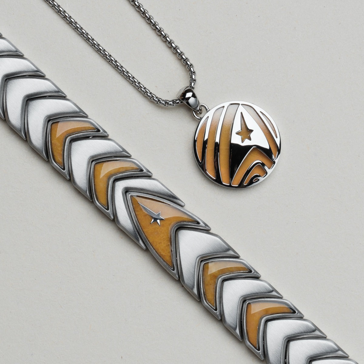 "Command", a jade and silver necklace, featuring geometric and star designs.