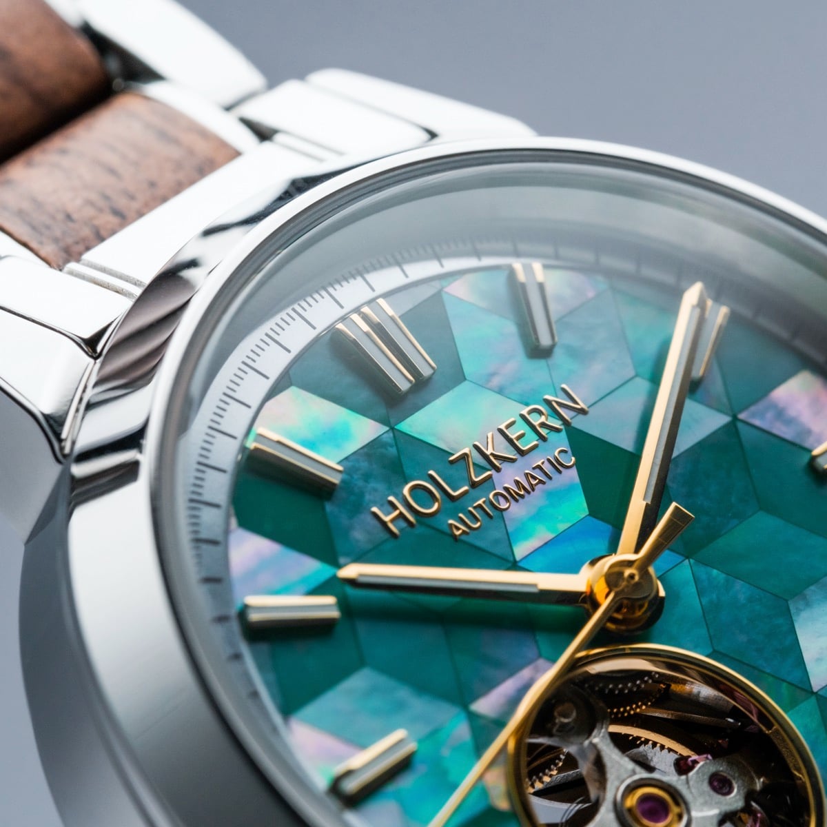 "Colorburst", a wristwatch with nacre dial and walnut accents, boasts a vibrant, stylish design.