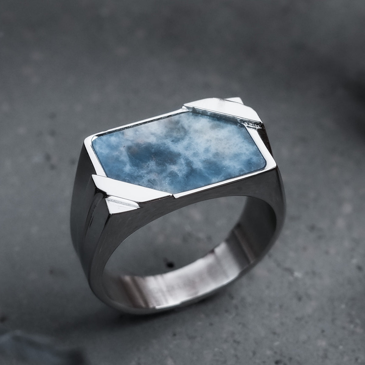 "Binomial Ring", a rectangular sodalite and silver ring with a modern geometric design.