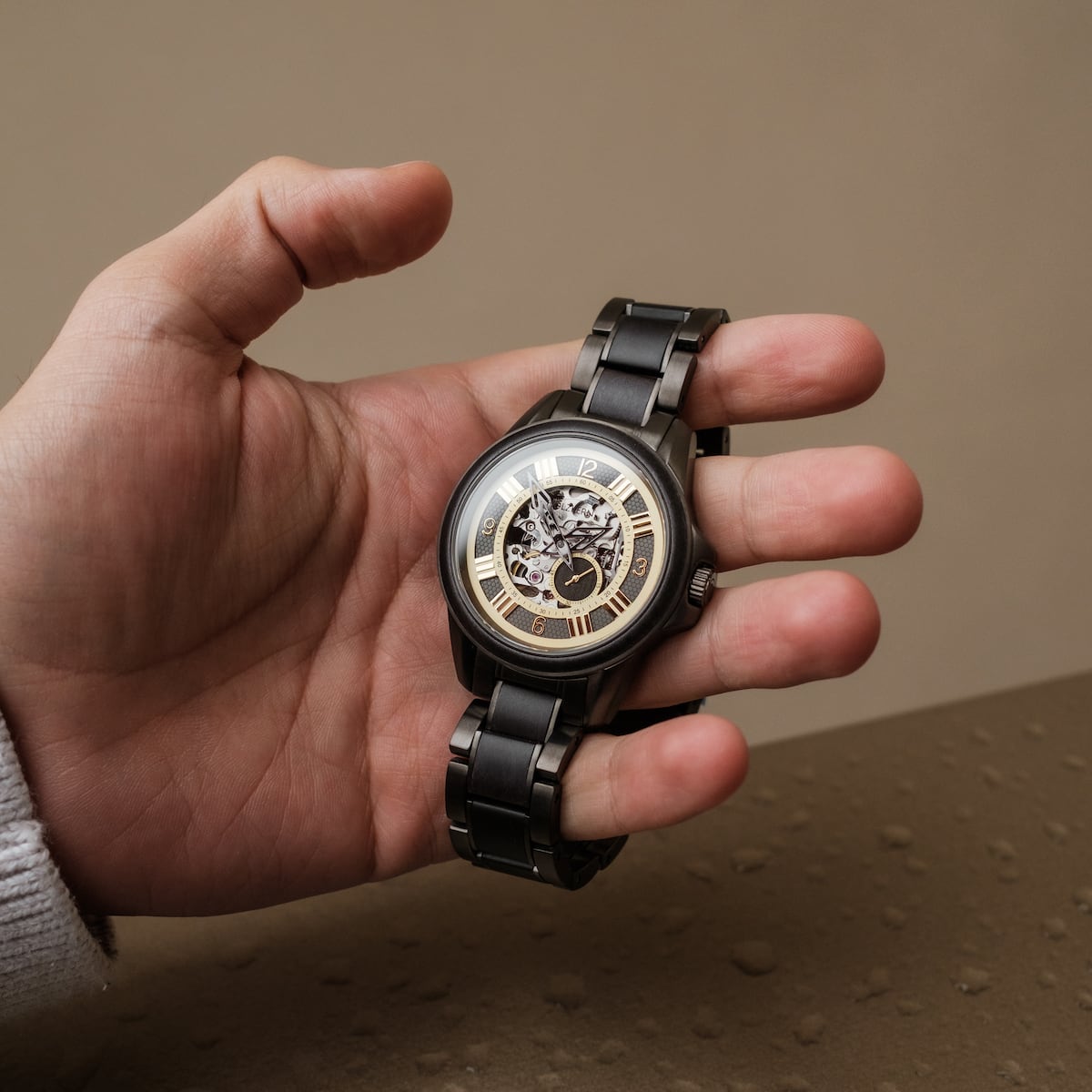 "Navona" wristwatch featuring a sleek metallic design with intricate inner mechanics visible through the dial.