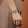 "Brighter" watch with a nacre dial and silver accents, offering an elegant and modern style.
