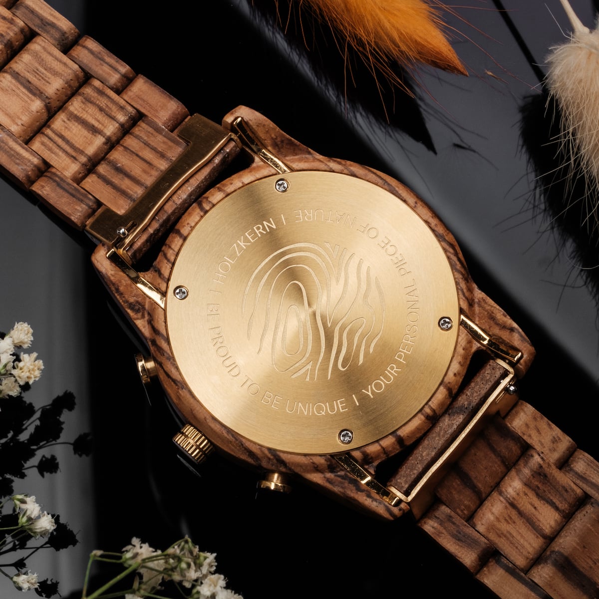 "Canopy", a stylish watch crafted with zebrawood and marble elements, featuring a unique engrained pattern on the back.