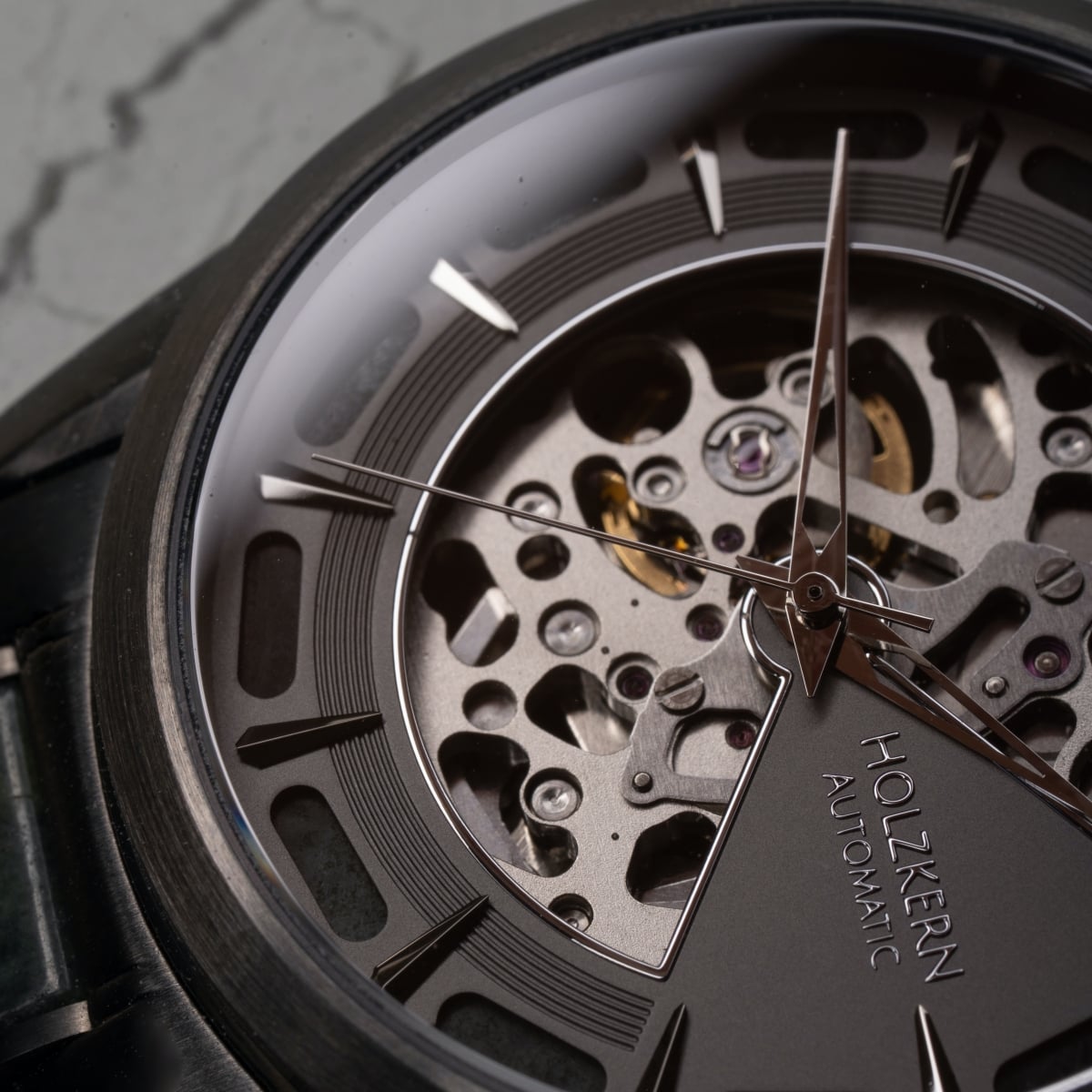 "Acraman" watch with marble and dark gray details, showcasing a sleek and modern design.